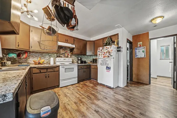 a view of entryway with furniture and paintings on the wall