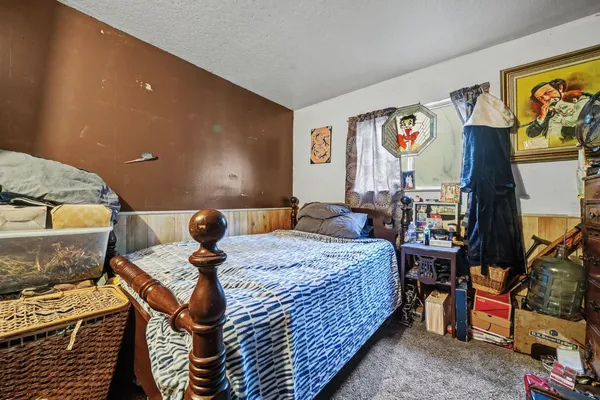 a view of a storage and utility room with closet dryer and washer