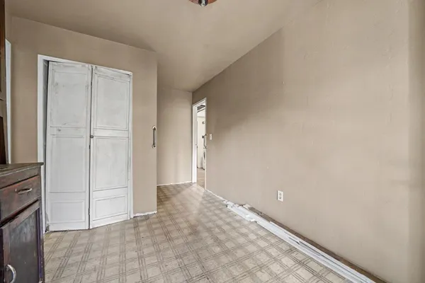 a view of a room with wooden floors