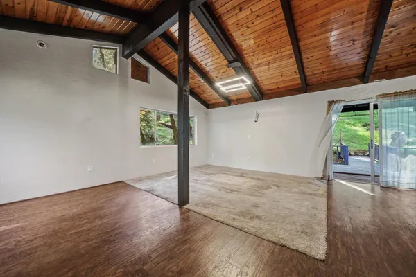 a kitchen with stainless steel appliances granite countertop a stove top oven a sink and a refrigerator