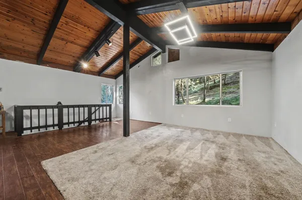 a kitchen with stainless steel appliances granite countertop a sink a stove and a microwave