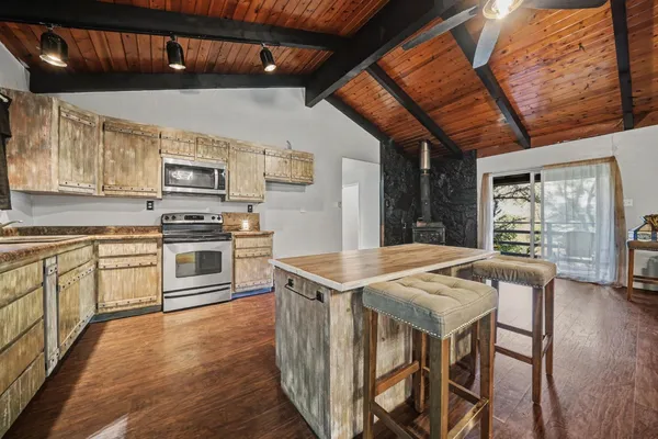 a view of a kitchen with furniture and a fireplace