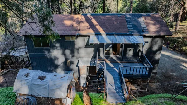 a view of a garden with a bench and a lake view