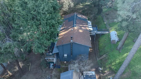 a view of a house with roof and sitting area