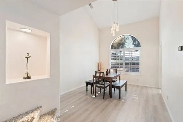 a view of a dining room with furniture window and outside view