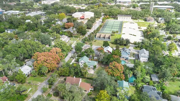 an aerial view of a house with a yard and garden