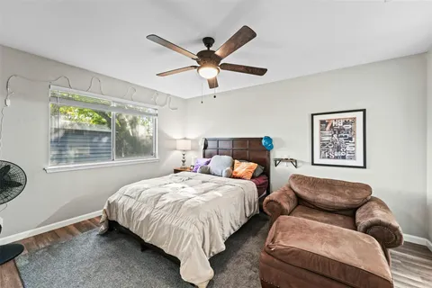 a bed room with a bed and a window