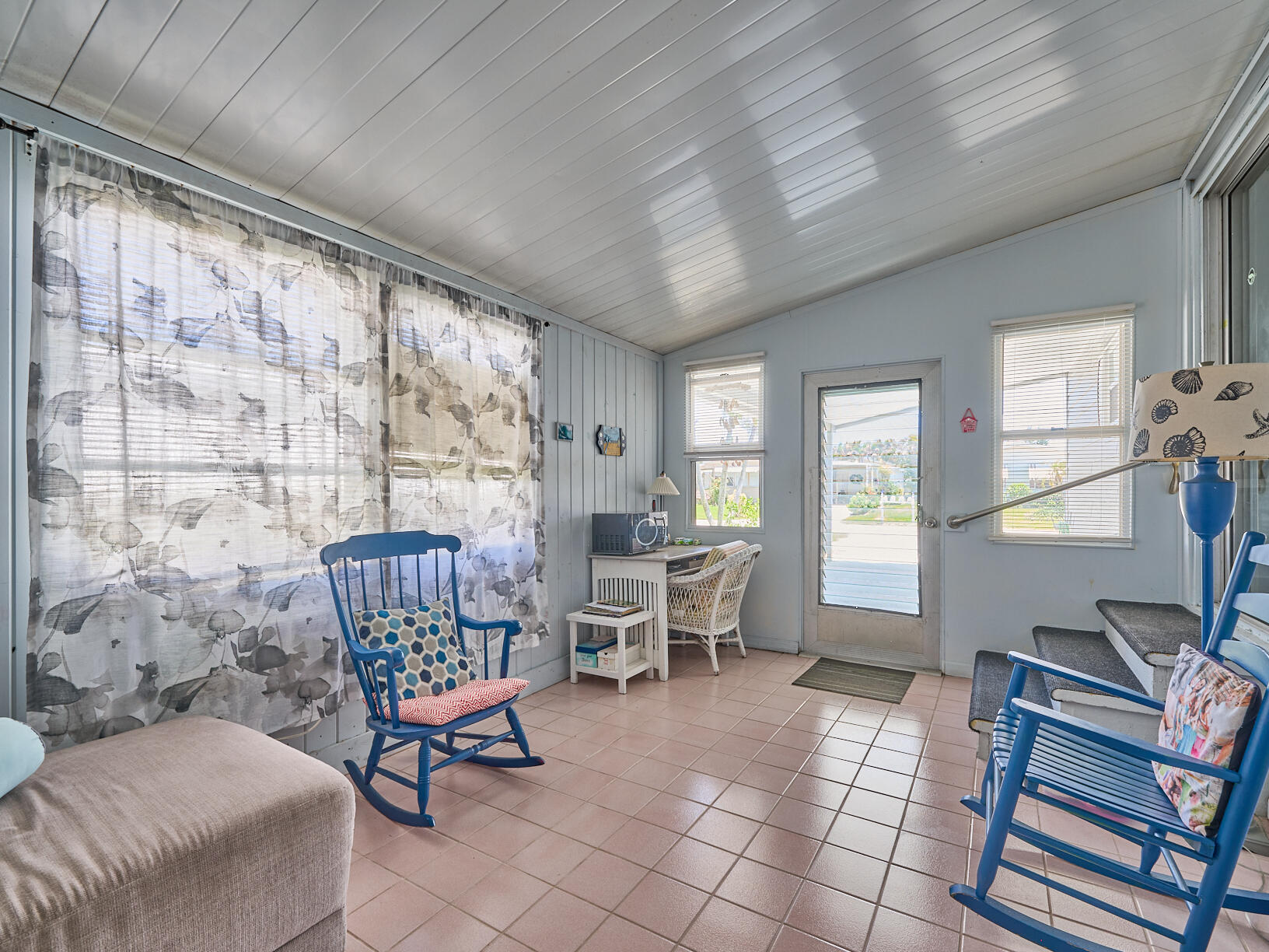 6977 Southeast Delegate Street Hobe Sound, FL 33455 - Photo 42 of 60 a living room with furniture and a window