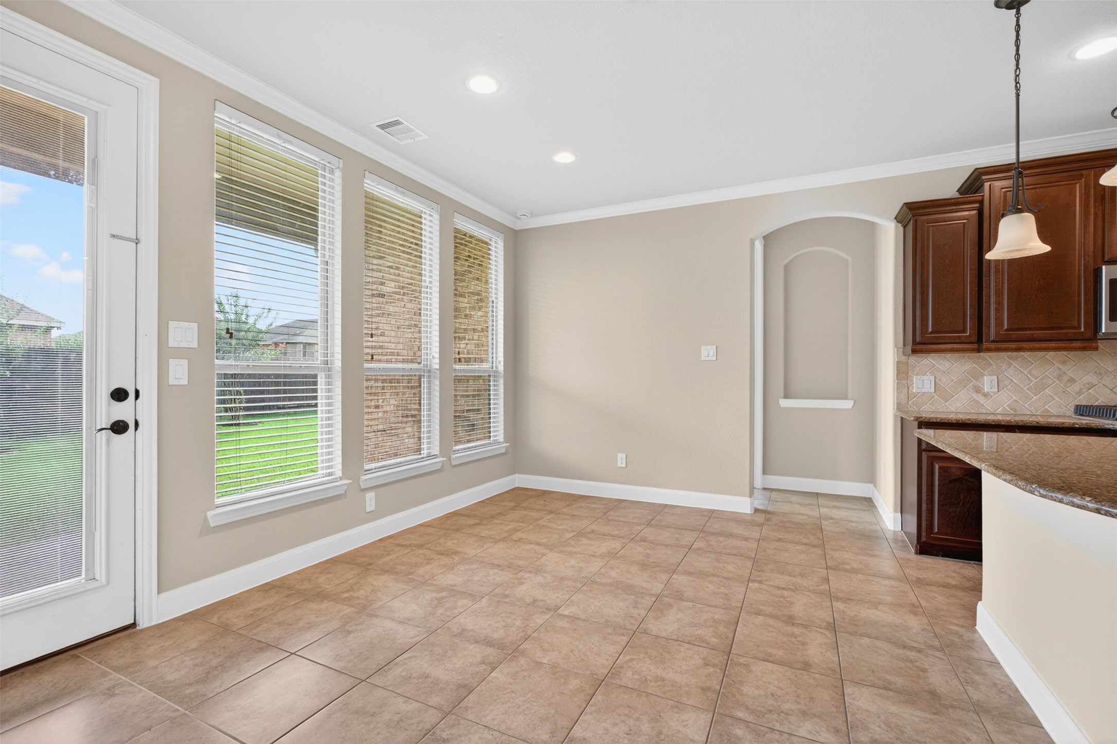 18202 Wedgewood Bluff Court Spring, TX 77379 - Photo 19 of 50 Breakfast area with large windows and views of the backyard.