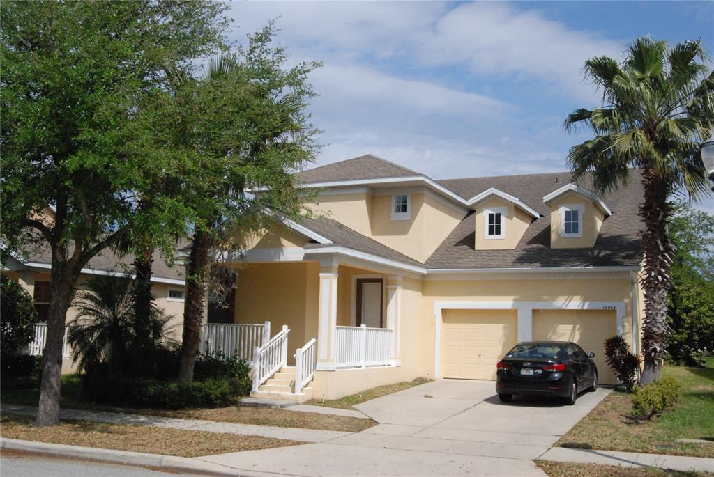 10063 Cobalt Bay Road Orlando, FL 32827 - Photo 1 of 1 a front view of a house with garden