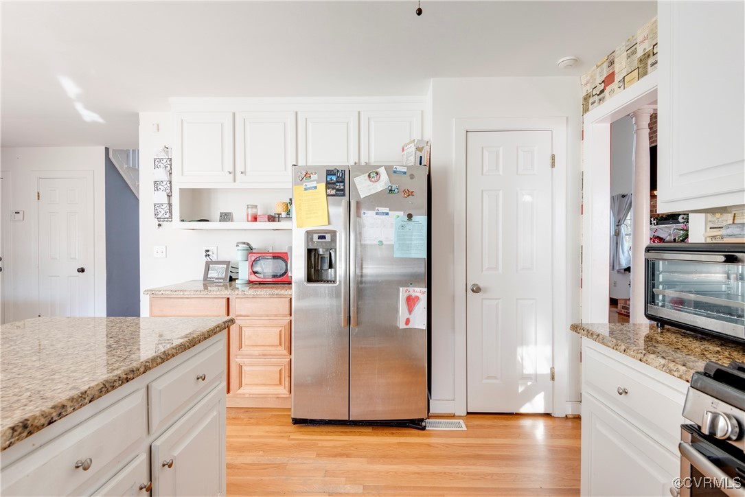 14055 Princess Mary Road Chesterfield, VA 23838 - Photo 14 of 41 Kitchen with white cabinets, appliances with stain