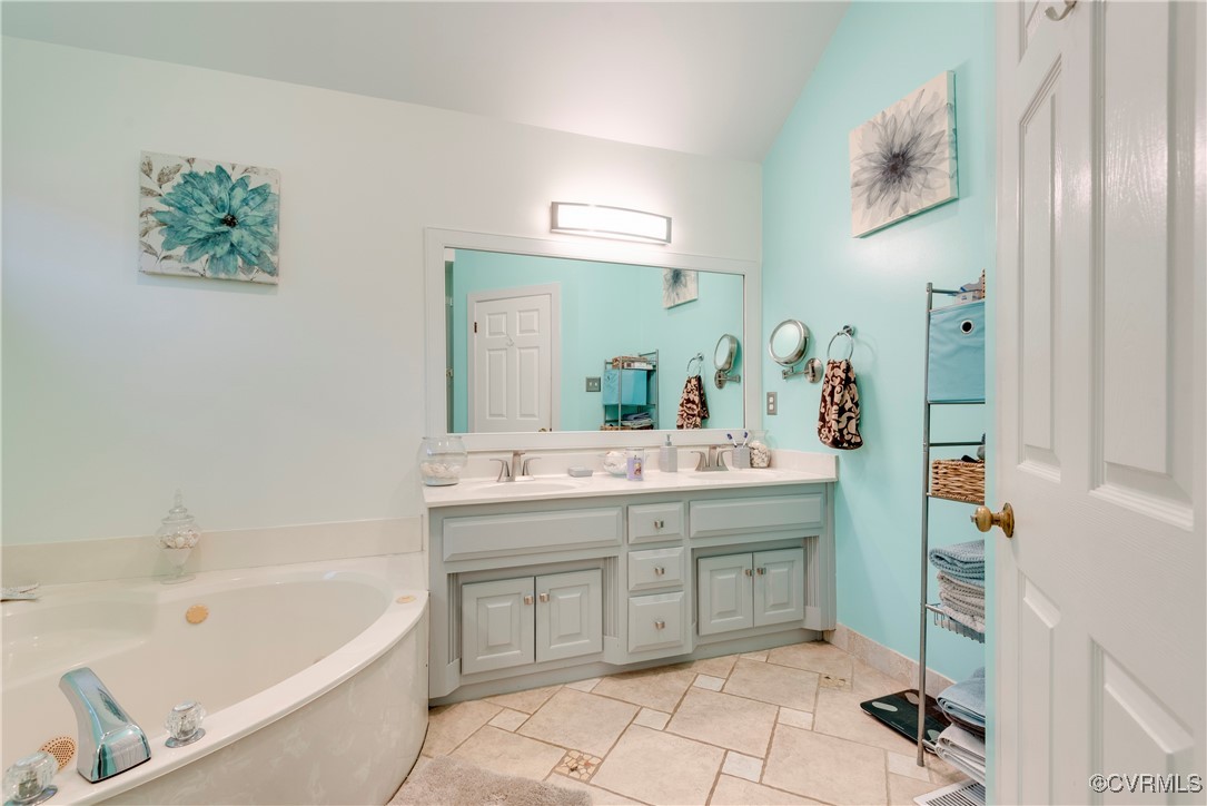 14055 Princess Mary Road Chesterfield, VA 23838 - Photo 23 of 41 Bathroom featuring a bathing tub, tile patterned f