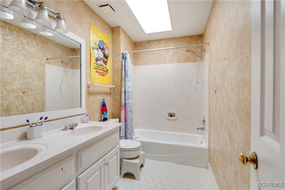 14055 Princess Mary Road Chesterfield, VA 23838 - Photo 32 of 41 Full bathroom featuring a skylight, tile patterned