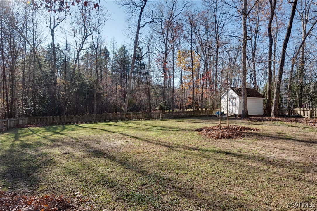14055 Princess Mary Road Chesterfield, VA 23838 - Photo 40 of 41 View of yard featuring a storage unit
