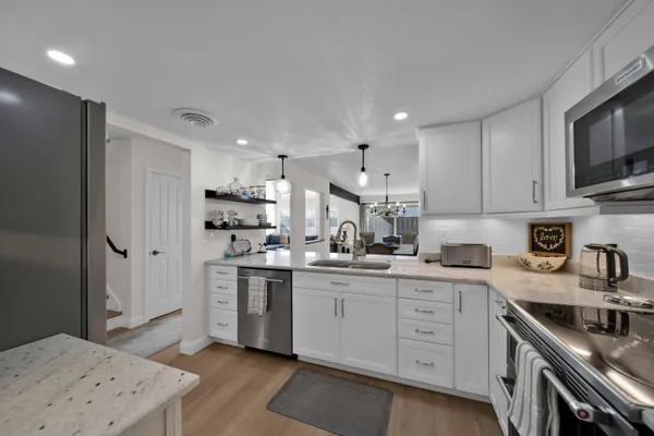 a kitchen with a refrigerator and cabinets