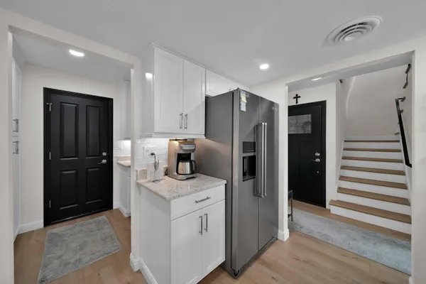 a utility room with sink dryer and washer