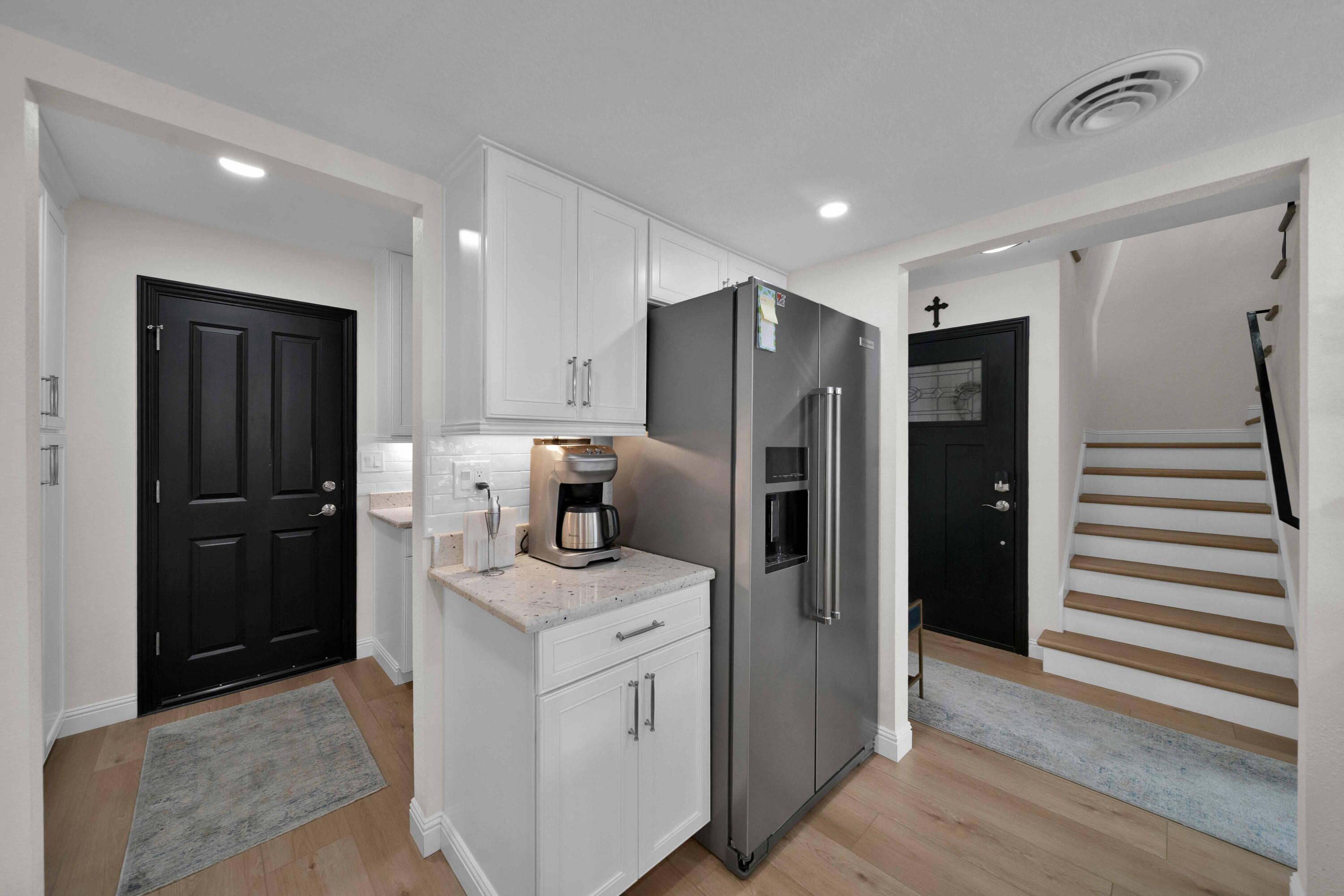 1928 Bechelli Lane Redding, CA 96002 - Photo 14 of 62 a kitchen with refrigerator and cabinets