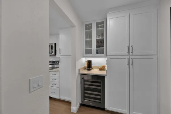 a view of a dining room with furniture and wooden floor
