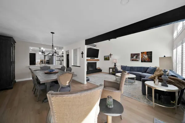 a living room with furniture ceiling fan and a window