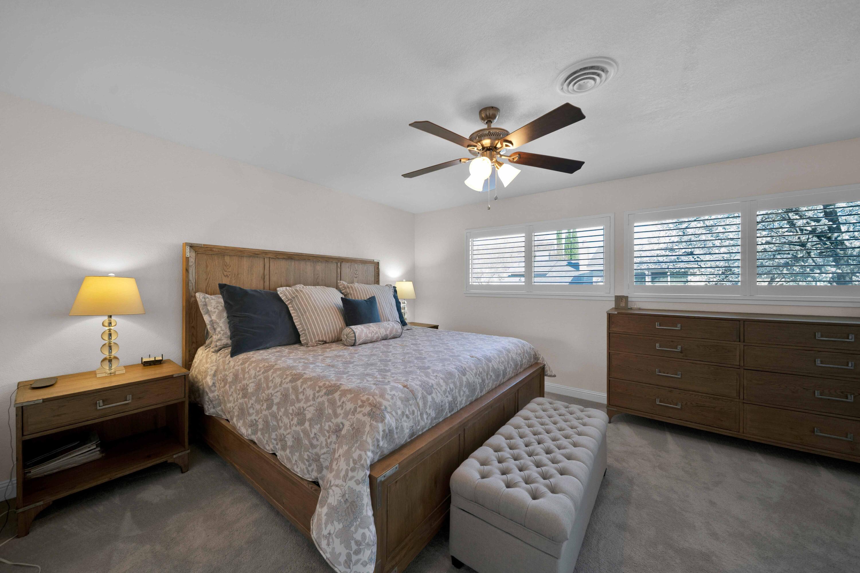 1928 Bechelli Lane Redding, CA 96002 - Photo 26 of 62 a bedroom with a bed and a window