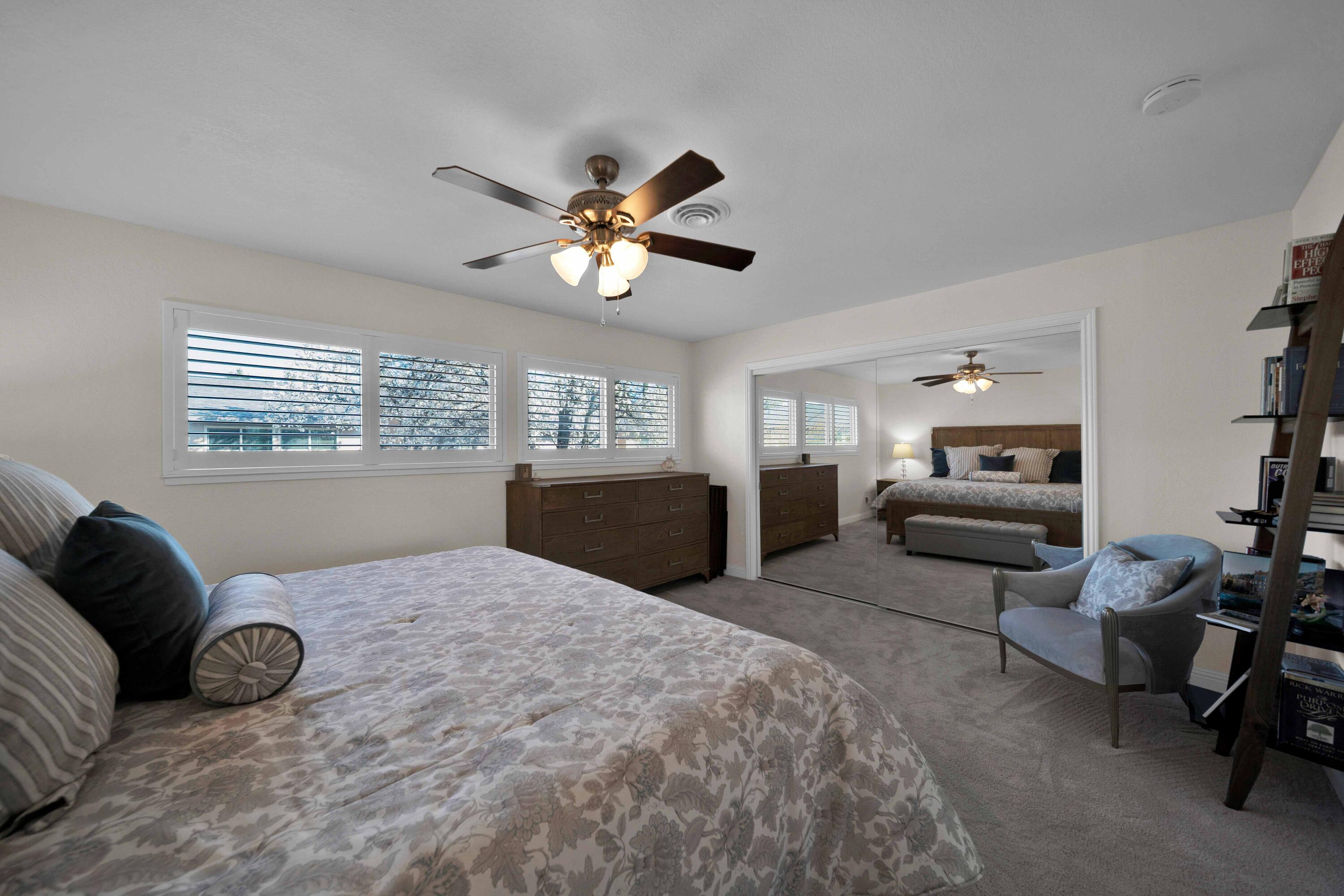 1928 Bechelli Lane Redding, CA 96002 - Photo 27 of 62 a living room with furniture ceiling fan and a window