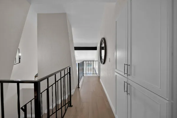 a view of a balcony with chairs