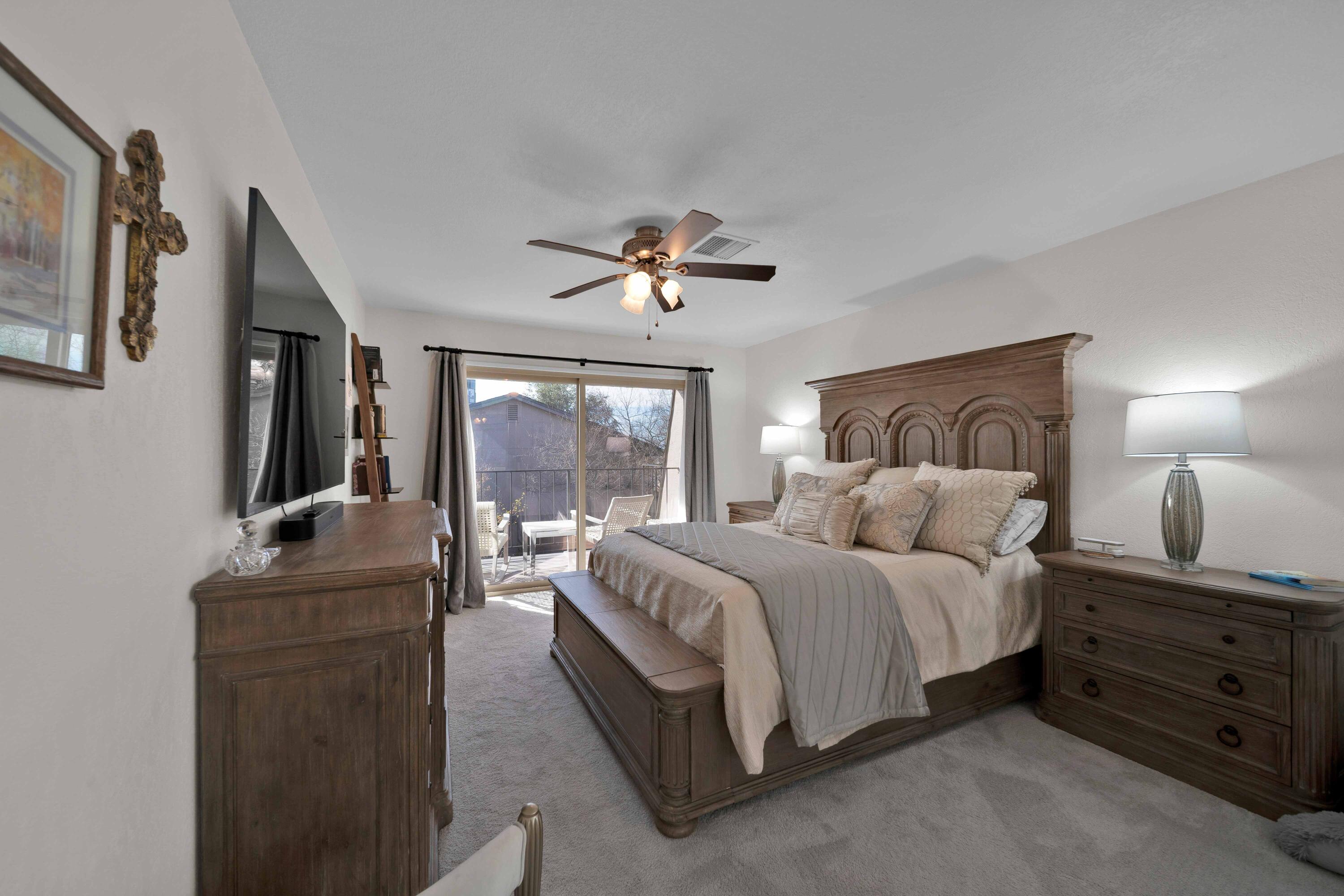 1928 Bechelli Lane Redding, CA 96002 - Photo 34 of 62 a bedroom with a bed and a couch