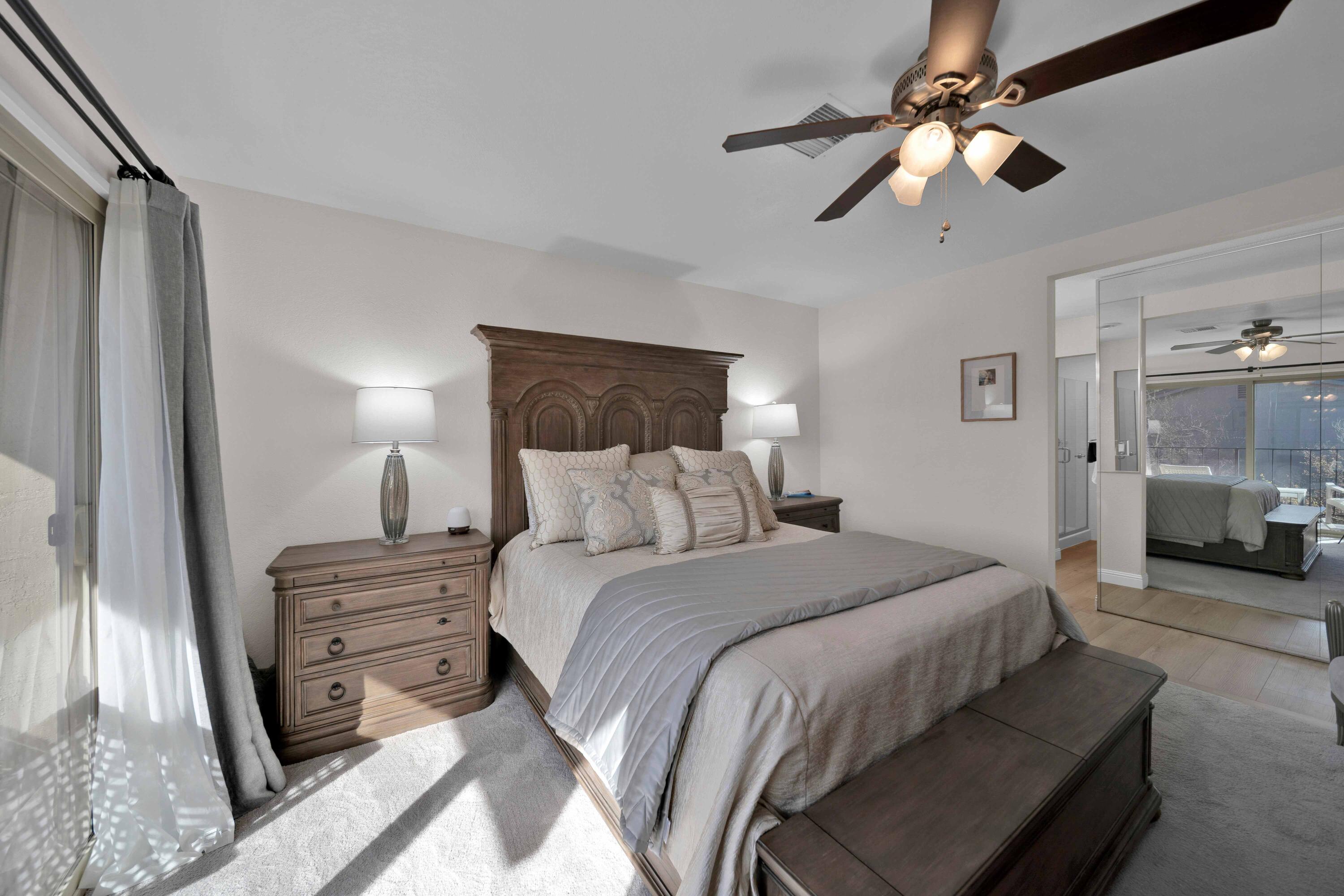 1928 Bechelli Lane Redding, CA 96002 - Photo 40 of 62 a bedroom with a bed and a chandelier