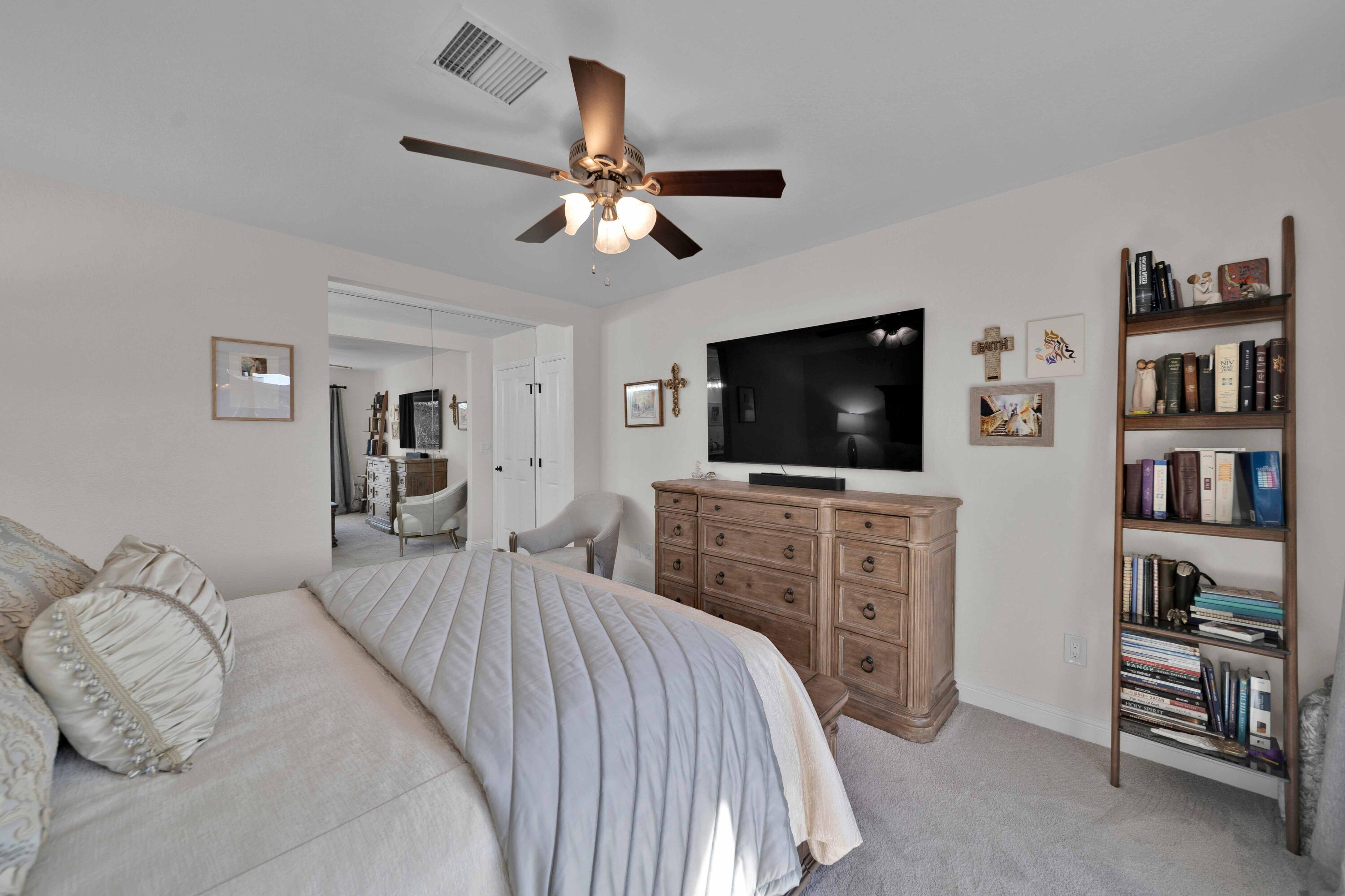 1928 Bechelli Lane Redding, CA 96002 - Photo 41 of 62 a bedroom with a bed and a flat screen tv