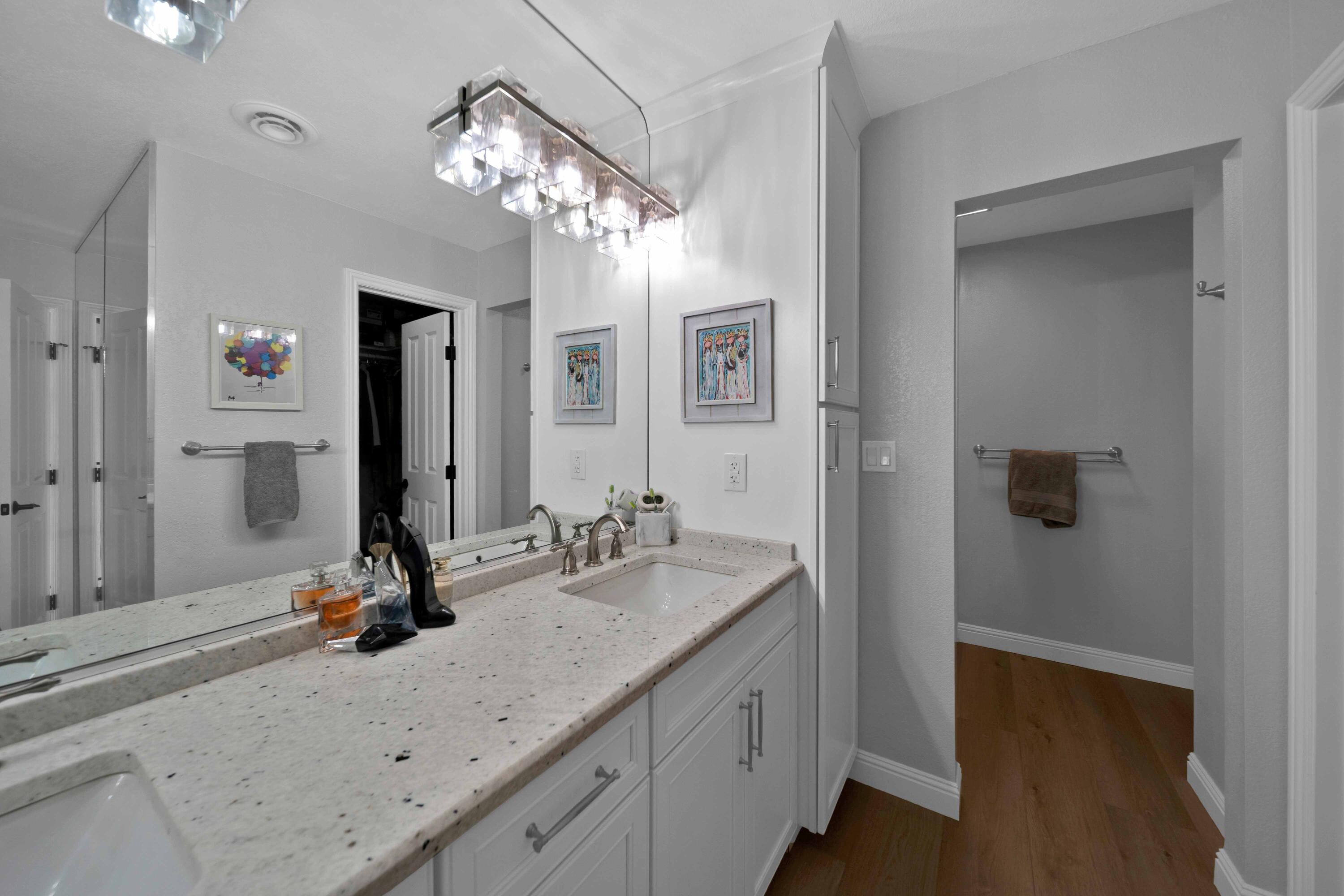 1928 Bechelli Lane Redding, CA 96002 - Photo 42 of 62 a bathroom with a sink double vanity and a mirror