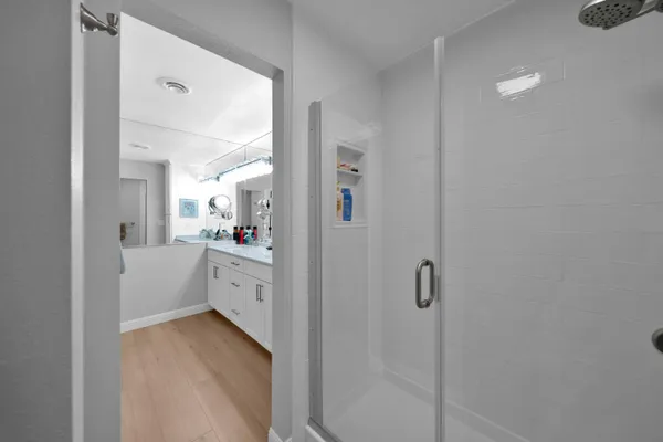 a view of a house with a small yard and wooden fence