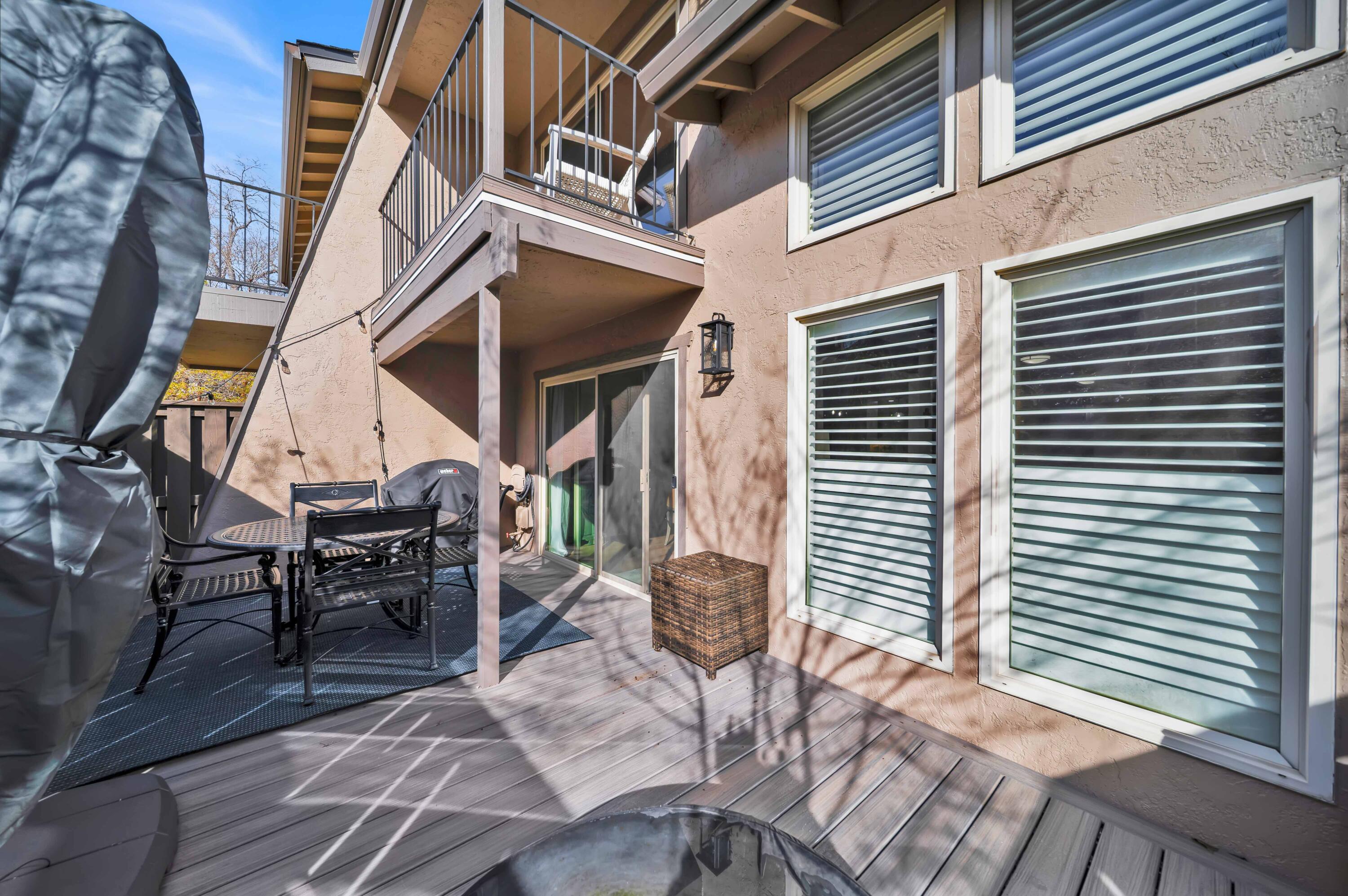 1928 Bechelli Lane Redding, CA 96002 - Photo 52 of 62 a view of a patio with couches table and chairs and a barbeque