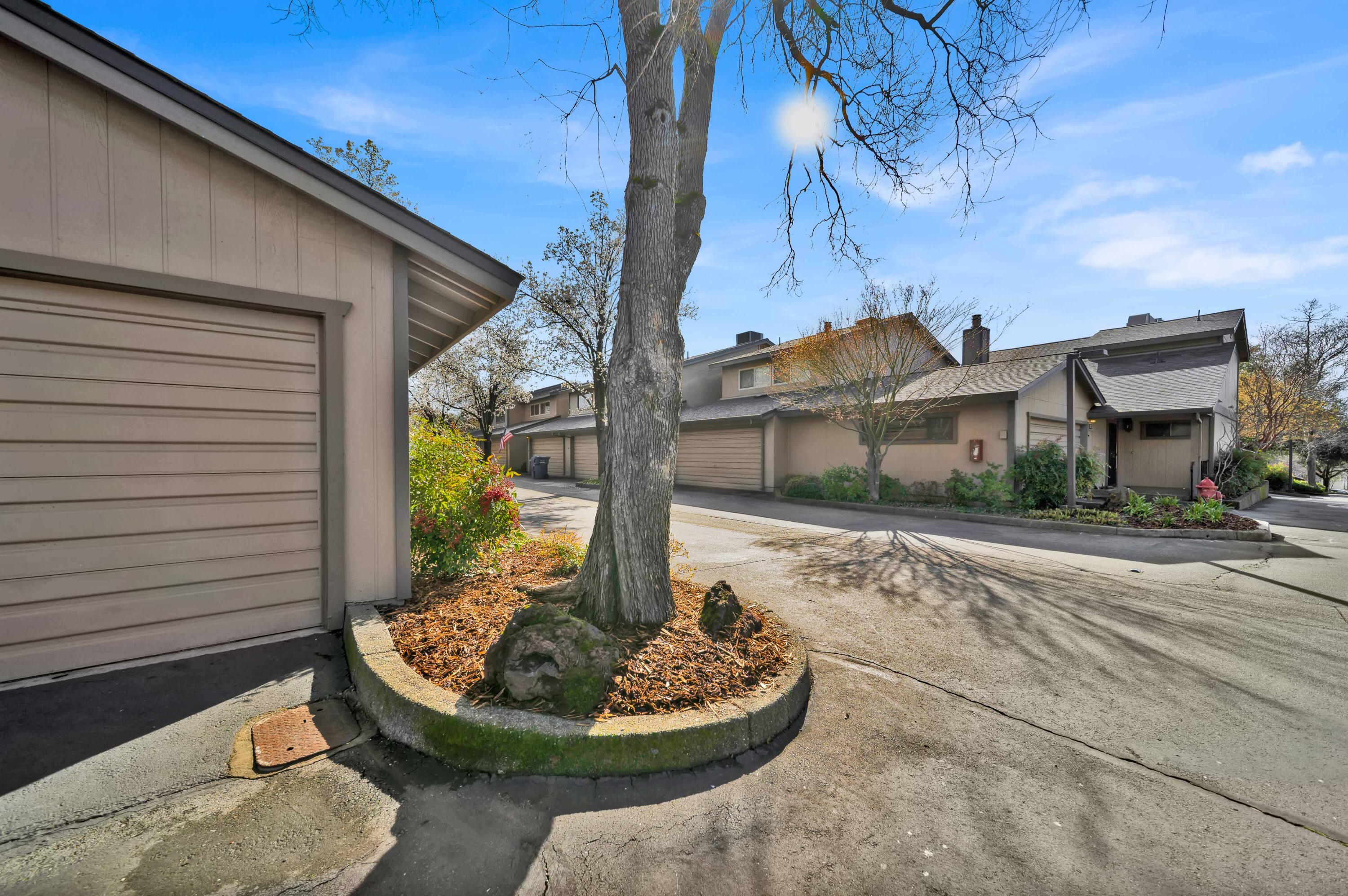 1928 Bechelli Lane Redding, CA 96002 - Photo 62 of 62 a backyard of a house with fountain table and chairs