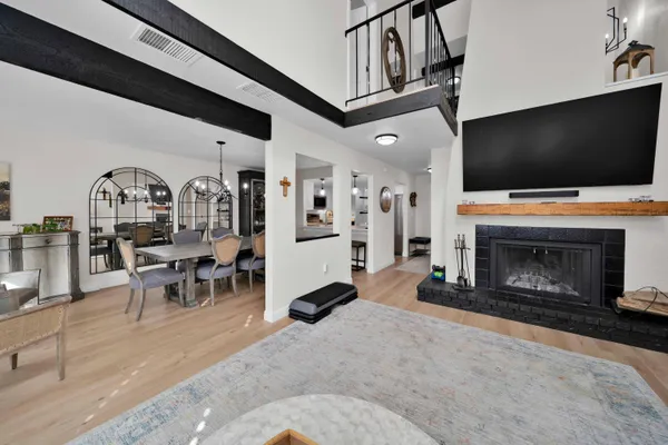 a large kitchen with stainless steel appliances kitchen island granite countertop a sink and a stove