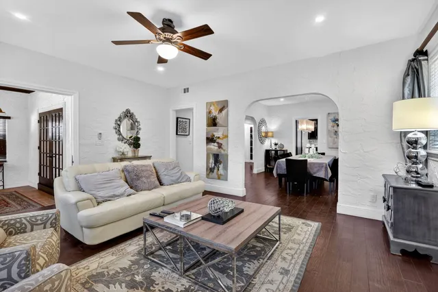 a bedroom with a bed and a flat screen tv on the dresser