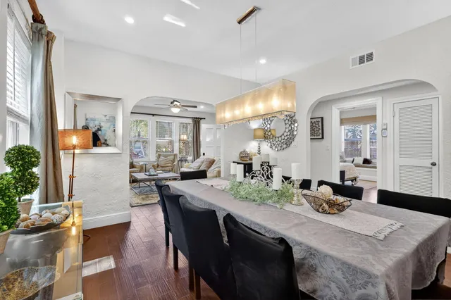 a view of a kitchen with staircase electronic appliances and stairs