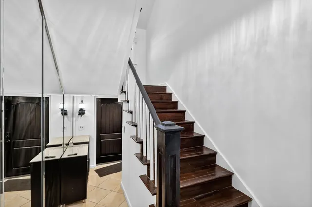 a bathroom with a sink toilet a mirror and shower