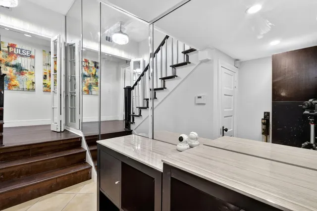 a bedroom with two beds and a large window