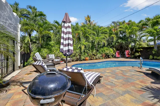a bathroom with a granite countertop sink toilet and mirror
