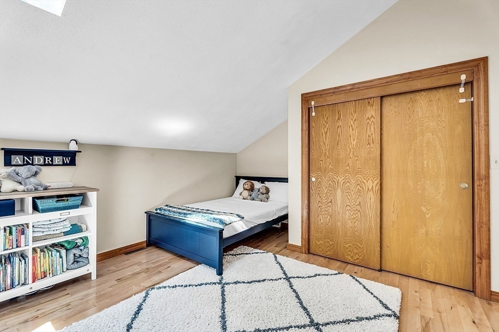 17 Berkshire Road Peabody, MA 01960 - Photo 29 of 41 a living room with furniture and a table