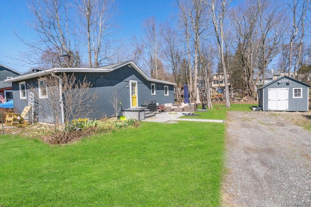 10 Locust Road Brewster, NY 10509 - Photo 1 of 21 a front view of a house with a yard
