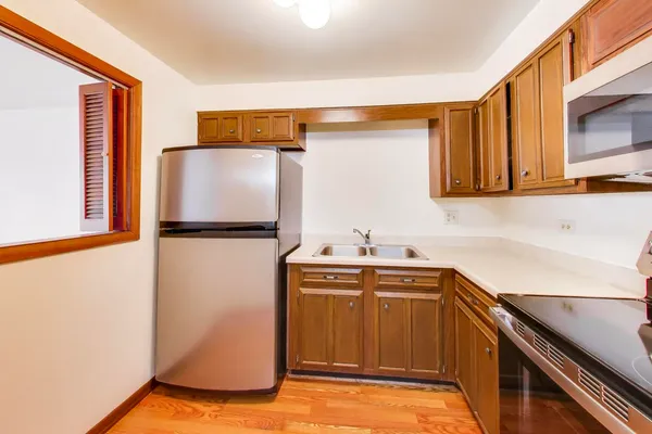 a kitchen with a sink and cabinets