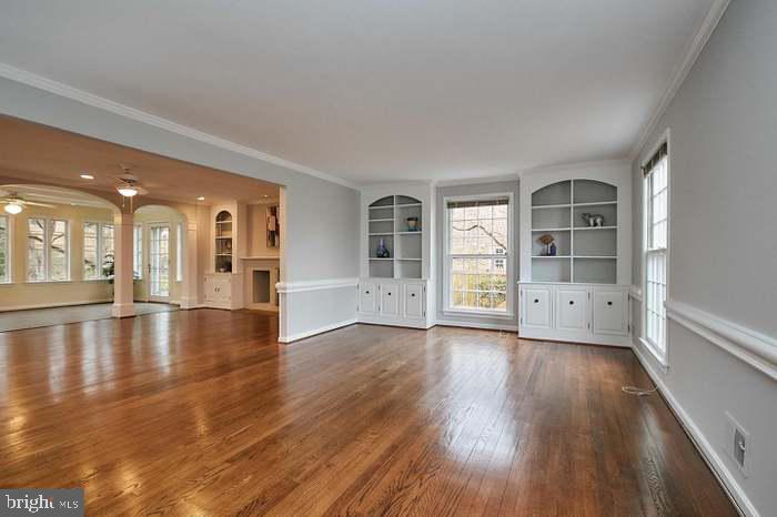 1006 Kimberwicke Road McLean, VA 22102 - Photo 12 of 42 an empty room with wooden floor and windows