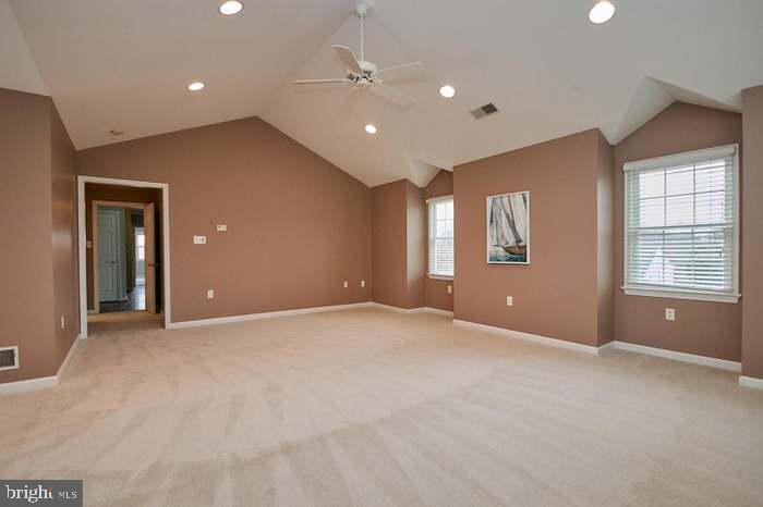 1006 Kimberwicke Road McLean, VA 22102 - Photo 20 of 42 a view of an empty room with windows and chandelier fan