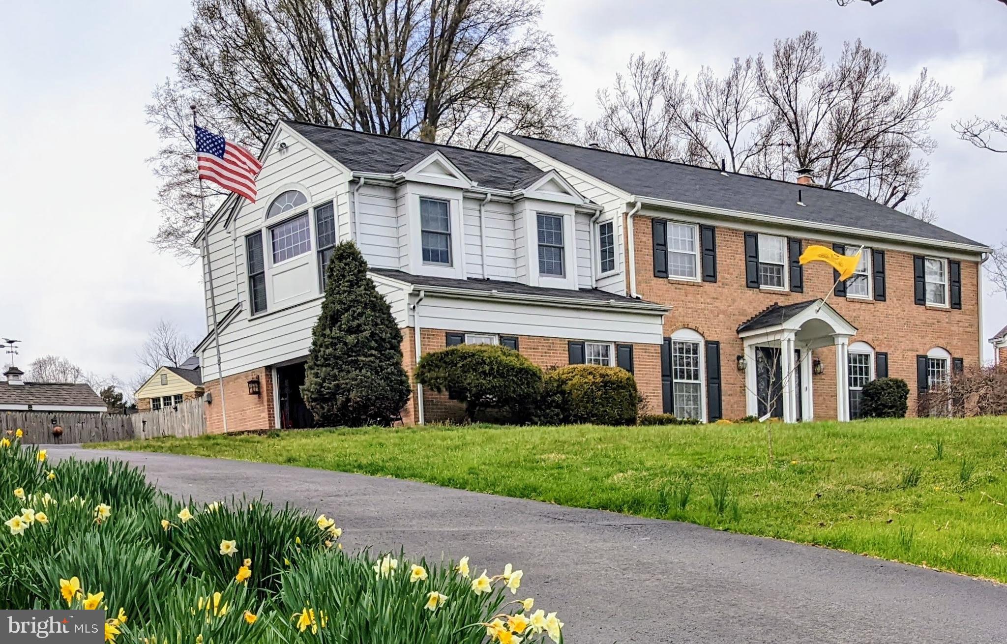 1006 Kimberwicke Road McLean, VA 22102 - Photo 2 of 42 a front view of a house with a garden