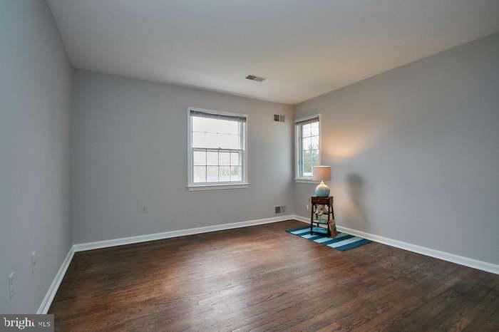 1006 Kimberwicke Road McLean, VA 22102 - Photo 26 of 42 an empty room with wooden floor and windows