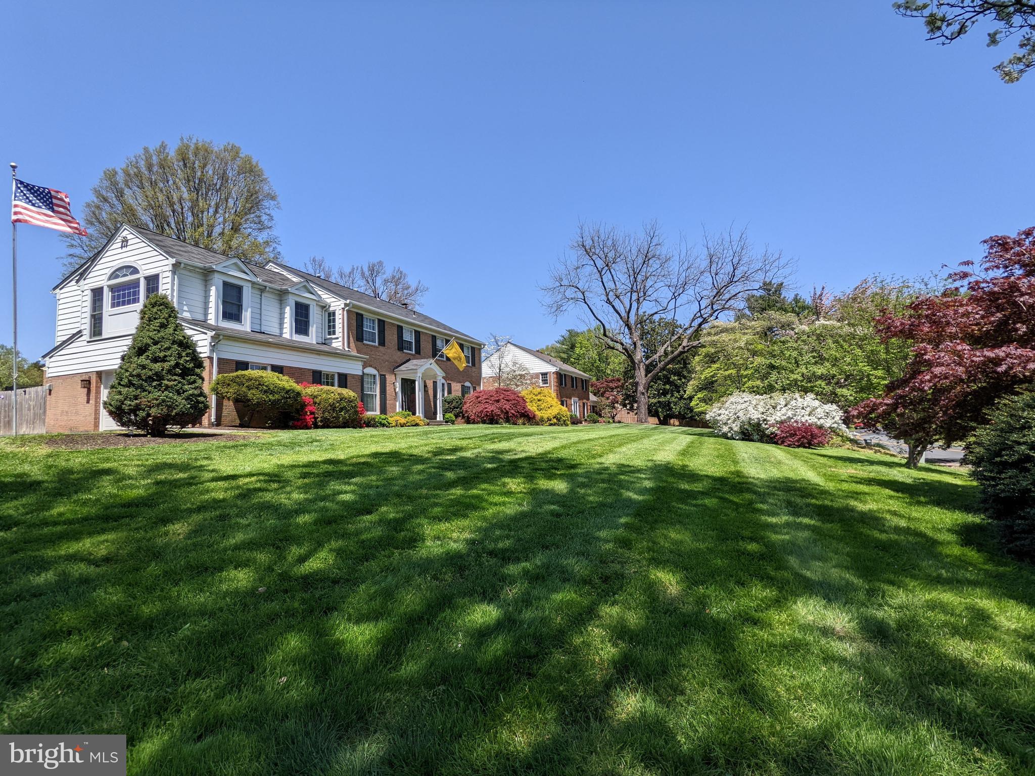 1006 Kimberwicke Road McLean, VA 22102 - Photo 3 of 42 a front view of a house with a garden