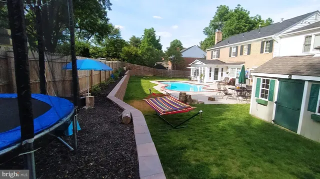 a view of house with a yard