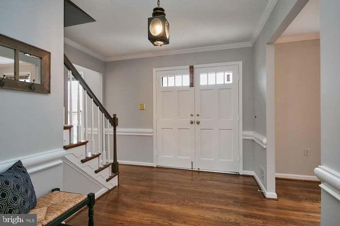 1006 Kimberwicke Road McLean, VA 22102 - Photo 8 of 42 a view of entryway and hall with wooden floor