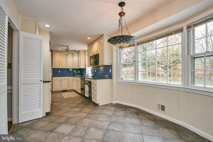 1006 Kimberwicke Road McLean, VA 22102 - Photo 10 of 42 a view of a kitchen with a sink and microwave